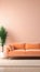 Clean, bright room with a peach fuzz color sofa. Peach fuzz color walls and floor.