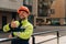 A clean builder shows sincere emotions of joy. man in special clothes and a hard hat