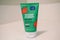 Clean and Clear brand Watermelon Juicy Scrub for face sits on a bathroom counter