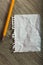 Clean crumpled sheet with pencil