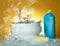 Clean dishes and cups, dishwashing detergent and sponge on a yellow in soap bubbles