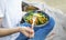 Clean eating, vegan healthy salad bowl closeup , woman holding salad bowl, plant based healthy diet with greens, salad, chickpeas