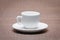 Clean and empty ceramic cup for espresso with saucer