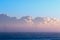 Clean energy. Misty morning wind turbines with low cloud bank at sea