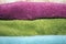 Clean folded towels of different colors - close-up