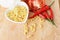 Clean foods concept with macro close up of elbow macaroni  on wooden board above