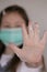 Clean hands concept. Hand washing.Coronavirus epidemic.Girl child in a medical protective mask shows hands in soap foam close-up.