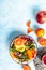 Clean healthy eating concept. Buddha bowl with avocado, blood orange, broccoli, watermelon radish, spinach, quinoa, pumpkin seeds