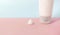 Clean label facial or body cream tube and product squeezed cream texture is isolated on a pink background. Banner for