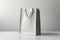 Clean lines, white sturdy bag stands upright on white background