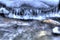 Clean mountain river stream in wintertime with icicles and small rocks closeup photo, multi exposure shot. full frame background