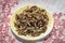 Clean shoot of traditionally dried under sun string beans on plate with table sheet