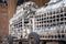 Clean silver dinner plates on carts at largest kitchen Langar Golden Temple in Amritsar, India. The Sikhs and volunteers prepare