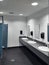 Clean simple public washroom sinks toilet stalls