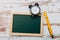 Clean vintage chalk board on a wooden table