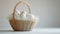 A clean, white background adorned with a single, intricately designed Easter basket filled with eggs