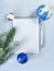 clean white Notepad sheet, place for writing, silver handle, green spruce branch, cotton branch, Christmas ball on blue