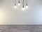 Clean white room with light bulbs