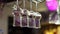 Clean wine glasses hanging upside down above a bar rack in restaurant