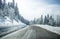 Clean winter road on mountain with turns and curve with trees un