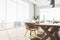 Clean wooden meeting room interior with window and city view, furniture and daylight.