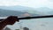 Clean worker washing glass panoramic window with view on flying airplane