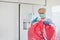 Cleaner disposes of infectious waste in clinic