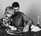 Cleaning activities concept. Man and child cleaning table with sponges.