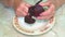 Cleaning the beetroot with a knife for cooking.