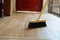 Cleaning broom on wooden floor