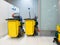 Cleaning Cart in the station. Cleaning tools cart and Yellow mop bucket wait for cleaning.Bucket and set of cleaning equipment