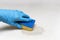 Cleaning company person Hands in rubber gloves do Mattress chemical cleaning. The process of cleaning with the help of a sponge