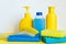 Cleaning concept with various plastic bottles and canisters on white background.cleaning supplies including sponges.various