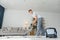 Cleaning concept. woman cleaning carpet with vacuum cleaner.