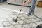 Cleaning concept. woman cleaning carpet with vacuum cleaner.