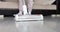 Cleaning with cordless vacuum cleaner floor of house