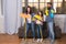 Cleaning day. Family mom dad and daughter with cleaning supplies at living room. We love cleanliness and tidiness