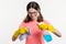 Cleaning day, spring cleanup, housework concept. Girl teenager in yellow gloves with rag and spray detergent.