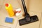 Cleaning of debris from the tile floor surface with a brush vacuum cleaner.