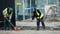 Cleaning debris workers in helmets on construction site