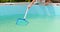 Cleaning frame pool with a skimmer net. Pool maintenance process