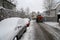 Cleaning of fresh snow on the streets of small town