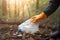 Cleaning garbage in bags in the park. Close-up of a volunteer collecting plastic waste. World cleaning or Earth day, Generative AI