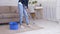 Cleaning at home. Unrecognizable housewife washing floor with mop and bucket