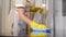 Cleaning in hotel. Close-up shot of young woman housekeeper in apron cleaning, wiping table surface with microfiber