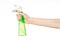 Cleaning the house and cleaner theme: man\'s hand holding a green spray bottle for cleaning isolated on a white background