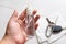 Cleaning keys with disinfectant in spray bottle on white background