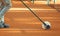 Cleaning the lines on a clay tennis court