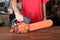 Cleaning and maintenance of the chainsaw by a person on a table