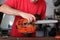 Cleaning and maintenance of the chainsaw by a person on a table